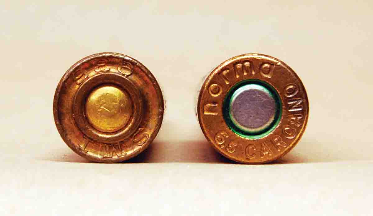 In 1895 a deep groove (left) was formed in the case head while commercial cartridges have no groove.